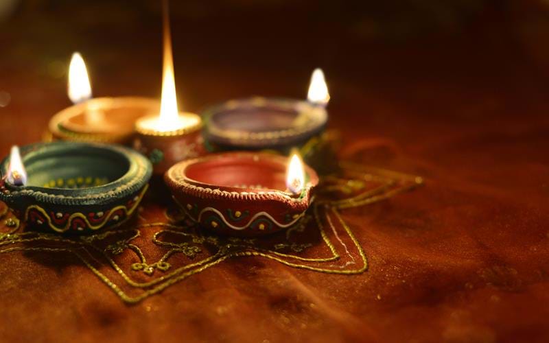 Traditional lamps lit for Diwali
