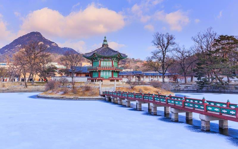 Gyeongbokgung Palace in winter cover by snow in Seoul, South Korea